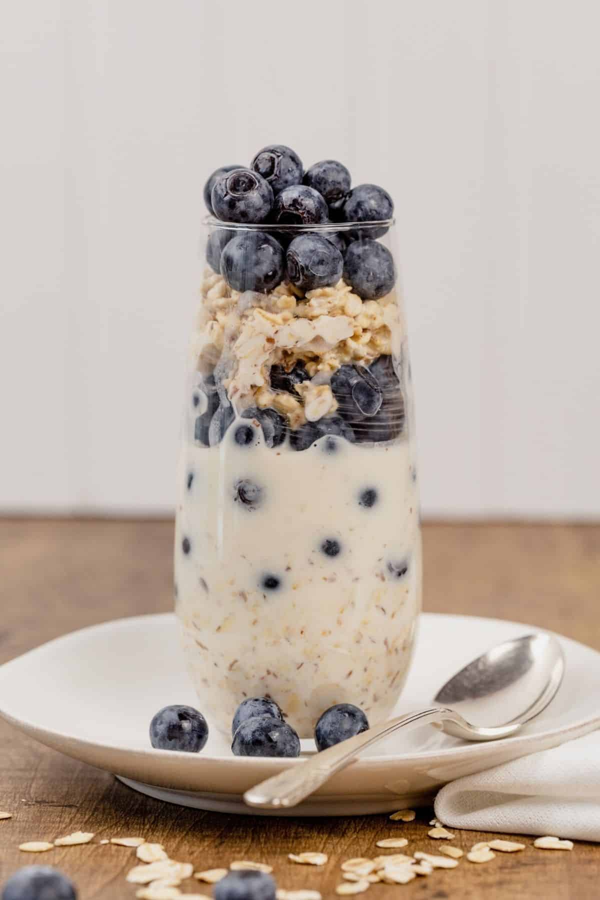 blueberry flavor overnight oats in a tall glass