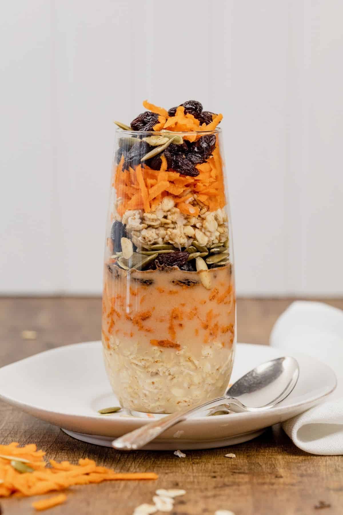 carrot cake flavor oats in a tall glass on the kitchen table