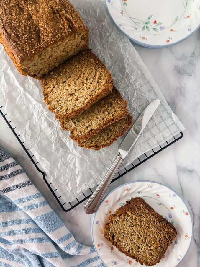 gluten free and vegan banana bread sliced and set on a plate // livingbeyondallergies.com