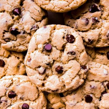 a pile of gluten free vegan chocolate chip cookies up close