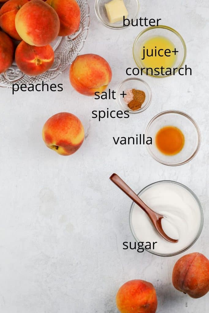 peach cobbler cupcake filling ingredients on a marble top