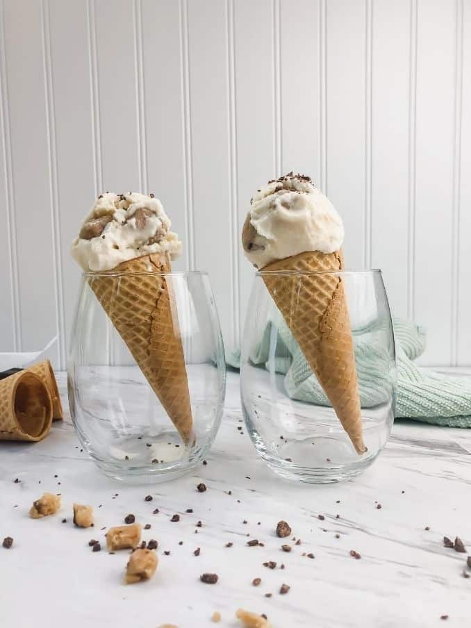 gluten free cookie dough ice cream in two sugar cones inside cups on a white table // livingbeyondallergies.com