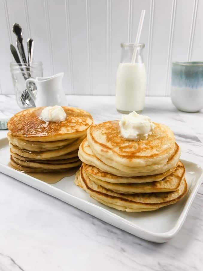 double stack of gluten free vegan pancakes on a white plate // livingbeyondallergies.com