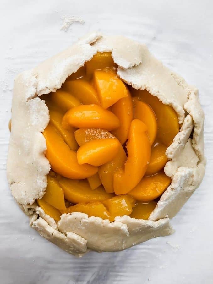 folded peach galette ready for the oven // livingbeyondallergies.com