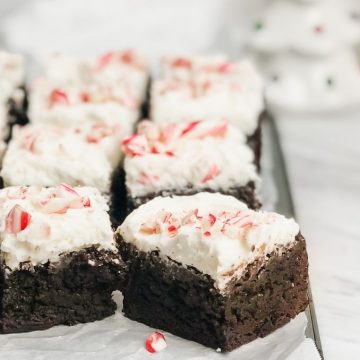close up of peppermint brownies on a baking tray with on the countertop