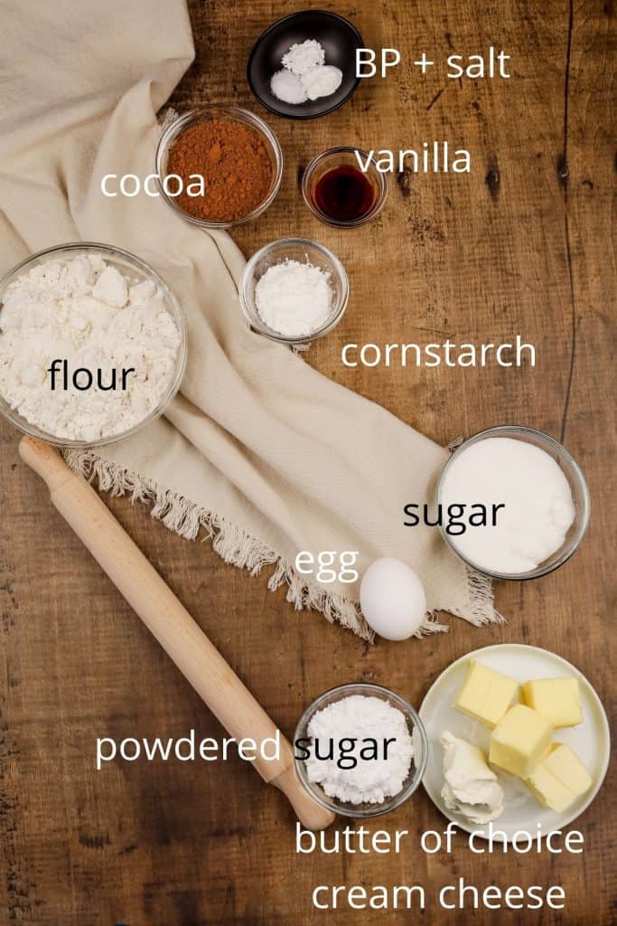 ingredients for gluten free chocolate sugar cookies in various bowls on the table