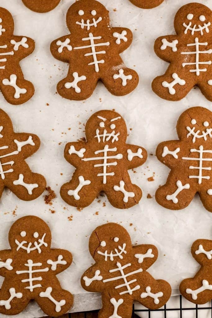 up close of chocolate skeleton cookies on white parchment paper