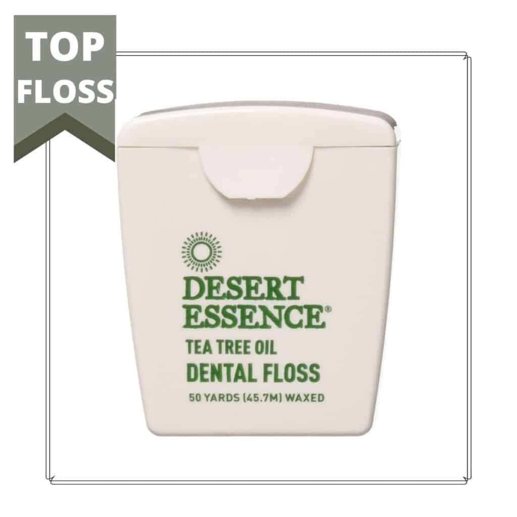 container of desert essence floss with a small sign that reads top floss