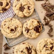close up of vegan chocolate chip cookies seen overhead with chopped chocolate on the side