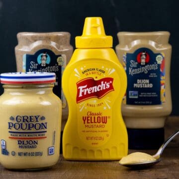 multiple bottles of different types of mustard