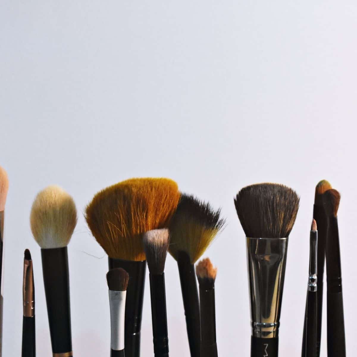 makeup brushes on a light background