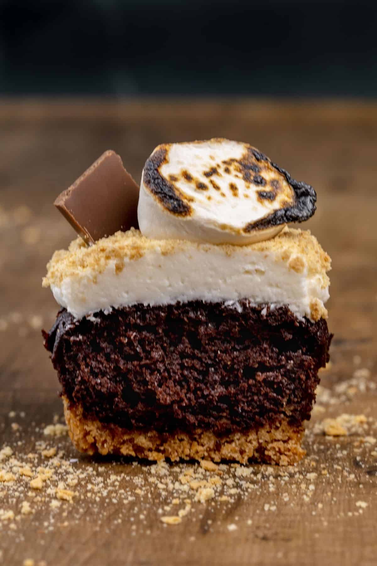 sliced view of a s'mores cupcake so you can see inside and the layers