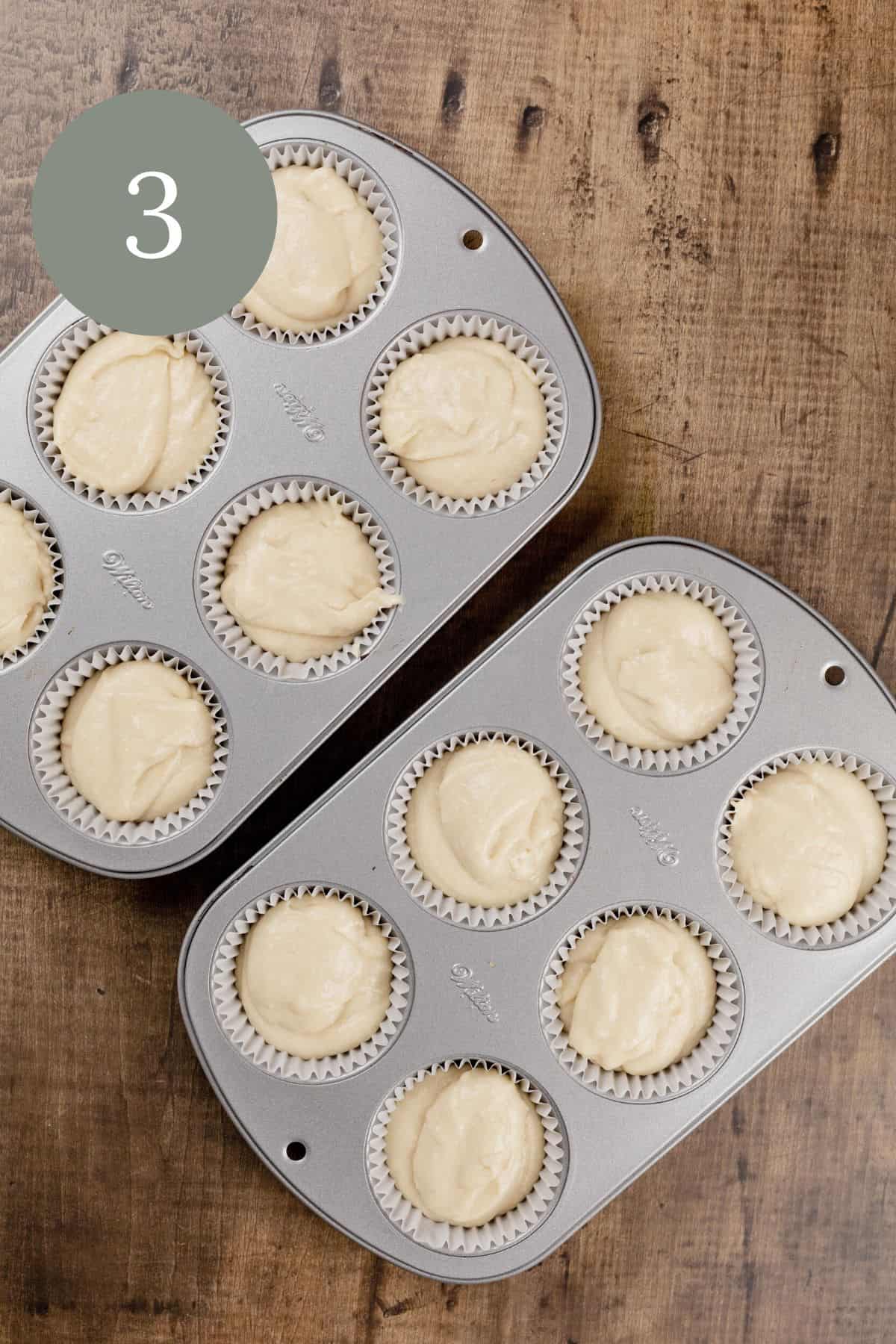 vanilla cupcake batter in the cupcake trays before baking
